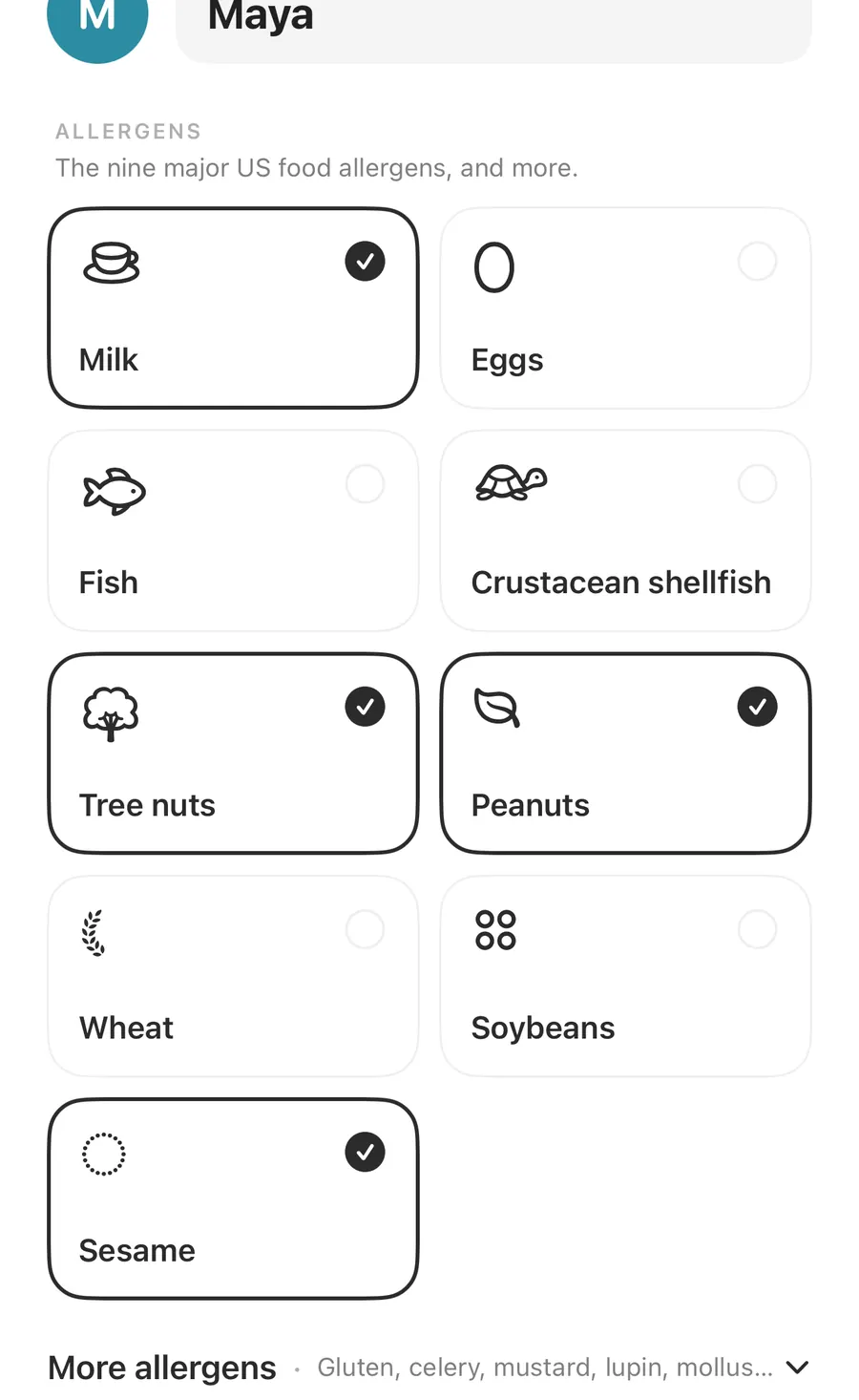 Allergens grid in an AllergenLens profile with milk, tree nuts, peanuts and sesame ticked, eggs, fish, crustacean shellfish, wheat and soybeans unticked, and a More allergens row listing gluten, celery, mustard and lupin